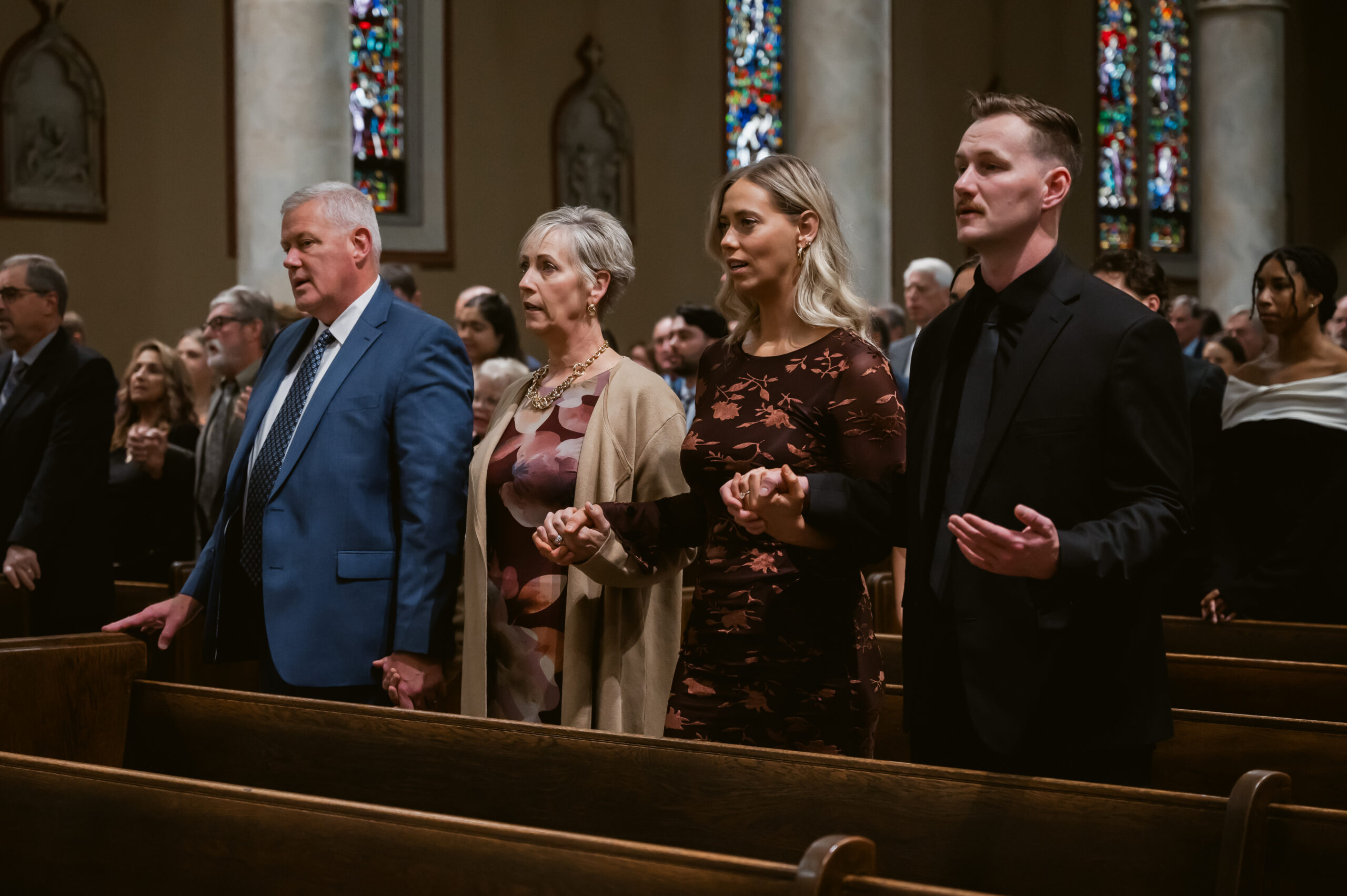 A family prays during a Catholic Wedding Mass in Ohio
