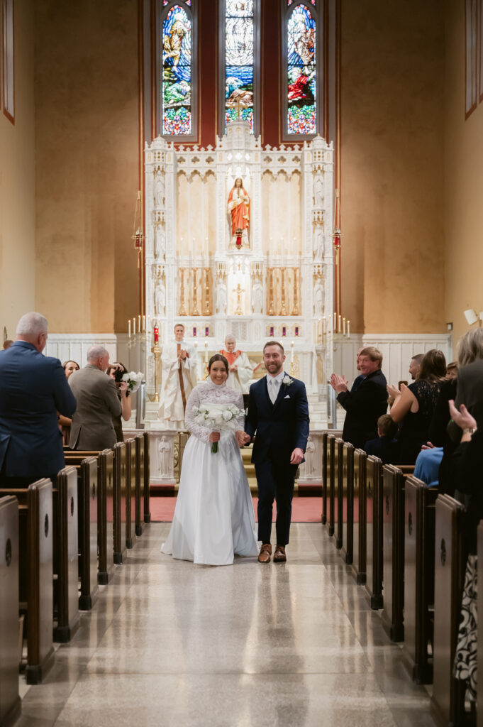 A Catholic Bride and Catholic Groom walk down the aisle during their Catholic Wedding Mass in Ohio. 