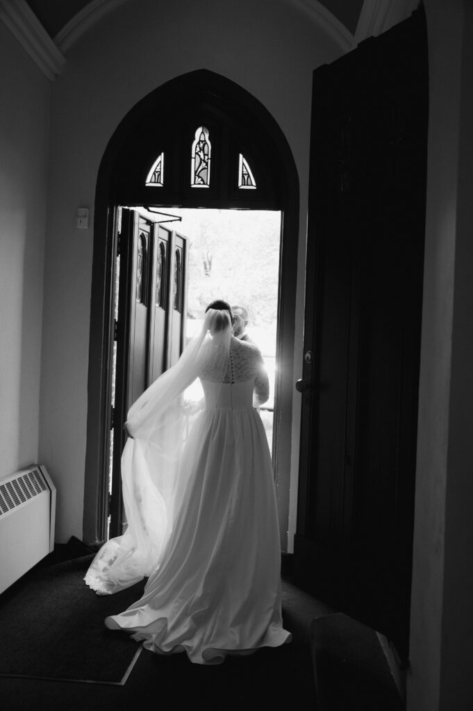 A Catholic Bride exists the church after her Catholic Wedding Mass in Ohio