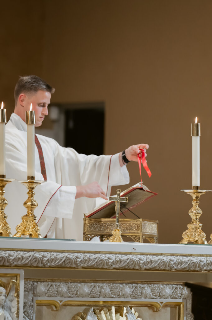 A Priest prepares the altar during a Catholic Wedding Mass in Ohio